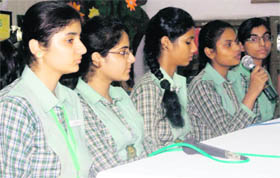 Students of Green Land Senior Secondary School participate in a mock radio show in Ludhiana on Monday.