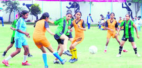 A match in progress between Kila-Raipur and Samrala zones in the District Inter-Zone Football Tournament at Kitchlu Nagar in Ludhiana on Monday