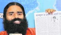 Baba Ramdev addresses a press conference in New Delhi 