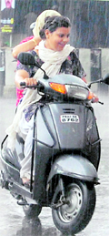 Girls caught in the rain in Amritsar