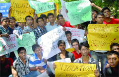 Third year students of Ramjas College protest against the new merit rule for hostel accommodation that evaluates students performance after each year, @@in New Delhi on Tuesday.