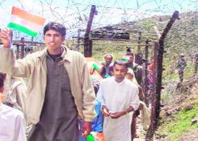 Villagers coming out of the fenced area
