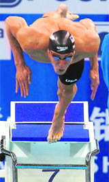 Michael Phelps of the U.S. jumps off the block during the mens 200m butterfly semifinal at the 14th FINA World Championships in Shanghai 