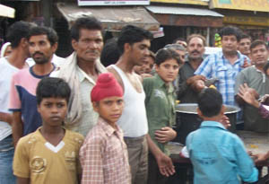 Residents distribute sweets in Fazilka. 