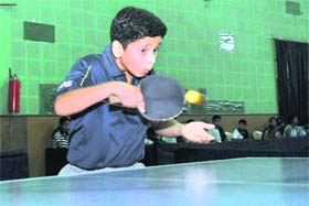 A player in action in a match in the Dehradun District Boys and Girls Table Tennis Tournament played in Dehradun on Wednesday