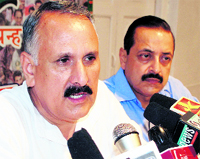 State president of the BJP Shamsher Singh Manhas (left), along with chief spokesman for the BJP Jatinder Singh, addresses a press conference in Jammu on Wednesday