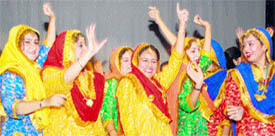 students present a folk dance during an induction day ceremony at the MCMDAV College for Women in Chandigarh on Thursday.