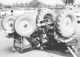 A tractor that overturned near Panchkula Golf Club at Sector 3 in Panchkula on Thursday.