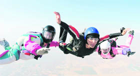 Archana along with her co-divers while performing skydiving.