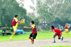 A match in progress in the Lala Nemi Dass Memorial District Football League played at the Pavilion ground in Dehradun on Thursday
