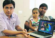 Dr Rajiv Kapila with six-year-old Kashni Bhagat and her father. 