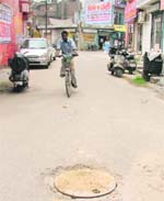 The manhole in Madhuban Enclave in which three members of a family almost fell yesterday was finally covered