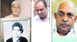 Fom left: Anand Sagar with a photo of his wife who died after falling in a manhole; Viji Raj who nearly fell in a manhole; and Rakesh Talwar with his compensation cheque.