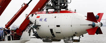 This photo, taken on July 1, 2011, shows the Chinese submersible Jiaolong as it is lifted into the Huanghai sea in Jiangyin, east Chinas Jiangsu province, in preparation for the countrys deepest manned dive. 