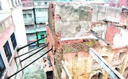 A century-old building supported by wooden planks in the Katra Ahluwalia area in Amritsar