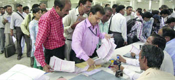 People queue up to file income tax return at Pragati Maidan in New Delhi 
