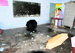 A leaking classroom of a government school at Majra in the Raipur block of Dehradun on Friday