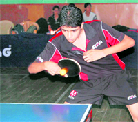 A player in action in the Dehradun District Table Tennis Tournament for boys and girls played in Dehradun on Friday