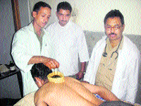 A patient being treated using the panchkarma therapy in Dharamsala.