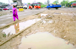 A potholed road at Kunjwani in Jammu