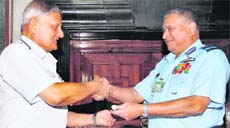 Chief of Naval Staff Admiral Nirmal Verma takes the baton of Chairman, Chiefs of Staff Committee, from outgoing Chief of Air Staff Air Chief Marshal PV Naik in New Delhi