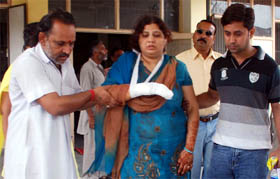An injured woman coming out of the emergency ward of the district hospital at Moga.