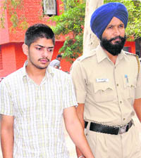 DAV college student Lawrence Bishnoi being taken to a court. 