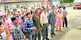 Members of the family of a missing IIPM staffer stage a protest in Dehradun
