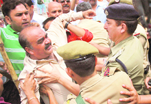 Activists of the BJP clash with the police during a protest on Saturday against the delay in making the Central University of Jammu functional.