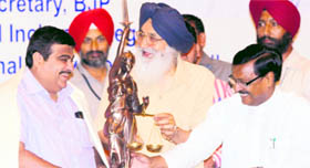 Punjab CM Parkash Singh Badal along with BJP national president Nitin Gadkari (left) and Satyapal Jain, national in charge of the BJP Legal Cell, in Chandigarh  on Saturday.