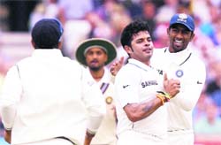 S Sreesanth (C) celebrates after taking the wicket of Jonathan Trott