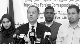 Khaled Bazelya, director of the Libyan English-language TV service, talks to the press in Tripoli on Saturday.