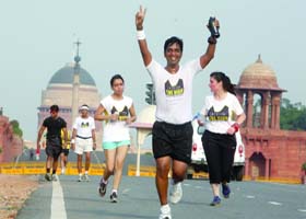 Sports enthusiasts take part in a "Running of the Elite Ultra Runners" in New Delhi on Sunday