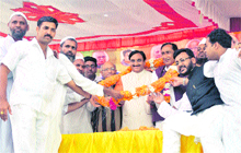 Uttarakhand Chief Minister Ramesh Pokhriyal Nishank is felicitated at a sammelan at Piran Kaliyar near Roorkee on Sunday.