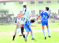 Players in action in a match in the Lala Nemi Dass Memorial District Football League on the Pavilion grounds in Dehradun on Sunday. 