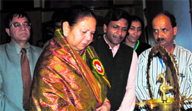 Governor Urmila Singh lights the traditional lamp on the occasion of Rafi Nite organised by the Uday Forum, Solan, at the Gaiety Theatre in Shimla on Sunday.