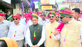 Chief Minister Prem Kumar Dhumal and other dignitaries participate in the concluding ceremony of the Minjar fair in Chamba on Sunday.