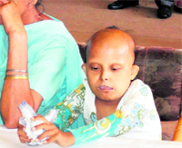 A special child awaits his turn at a medical check-up camp in Ludhiana