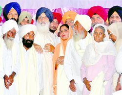 Chief Minister Parkash Singh Badal with kin of freedom fighters at Sunam on Sunday