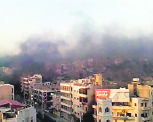 A view shows the smoke rising in the city of Hama in this still image taken from a video on Sunday. 