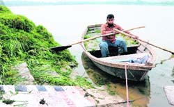 The scale shows the water level of the Sukhna Lake at 1,154 feet, about eight feet less than the same period the previous year.