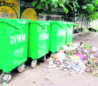 Garbage lying outside new bins put up at various places by the Dehradun Municipal Corporation 
