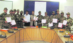 Personnel of the Bengal Engineer Group (Bengal Sappers), who saved 115 persons from drowning during the Kanwar fair, are felicitated by ADM SN Pandey at CCR Towers in Haridwar on Monday.
