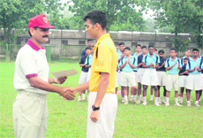 Col PK Kumaria, Commandant, Rashtriya Indian Military College, gives awards to the winners of the cross-country competition in Dehradun on Monday.