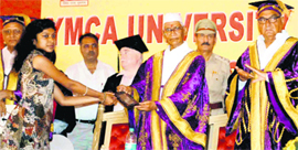 Governor Jagannath Pahadia gives away an award to a student at the convocation of the YMCA University of Science and Technology in Faridabad on Monday as Chief Minister Bhupinder Singh Hooda looks on.