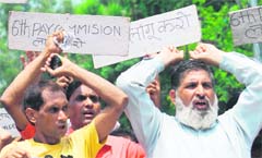 Members of the All-Jammu and Kashmir State Road Transport Corporation Workers Union hold a protest in Jammu