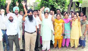 Clerical staff of the Health Department stage a protest in Ludhiana on Monday