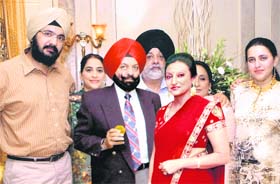 Ronjans parents, Malwinder (third from left) and Geetanjali, (third from right) celebrate his achievement with relatives at their residence in Feroezpur