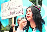 Activists demonstrate in front of the Chinese embassy in Vienna to protest against the repression of China's Uyghur minority in Xinjiang on Monday. 