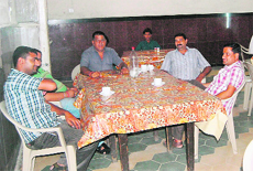 Passengers have meals at the canteen in Amritsar railway station.